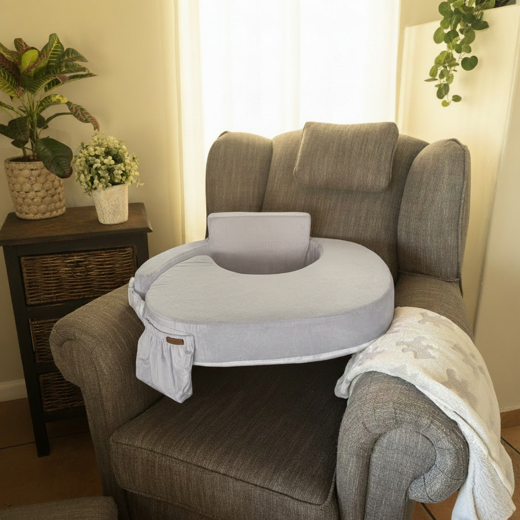 Grey pillow on chair with window